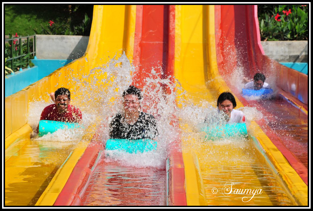 pictures of people having fun. People having fun on the water rides at Wonder-la Bangalore